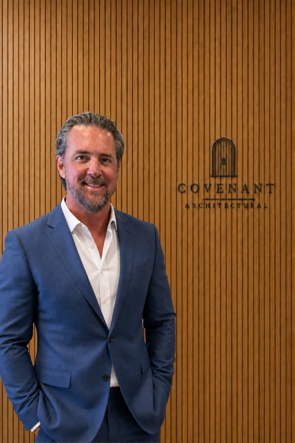 Chris Roberts, President and CEO, beside the Covenant Architectural logo